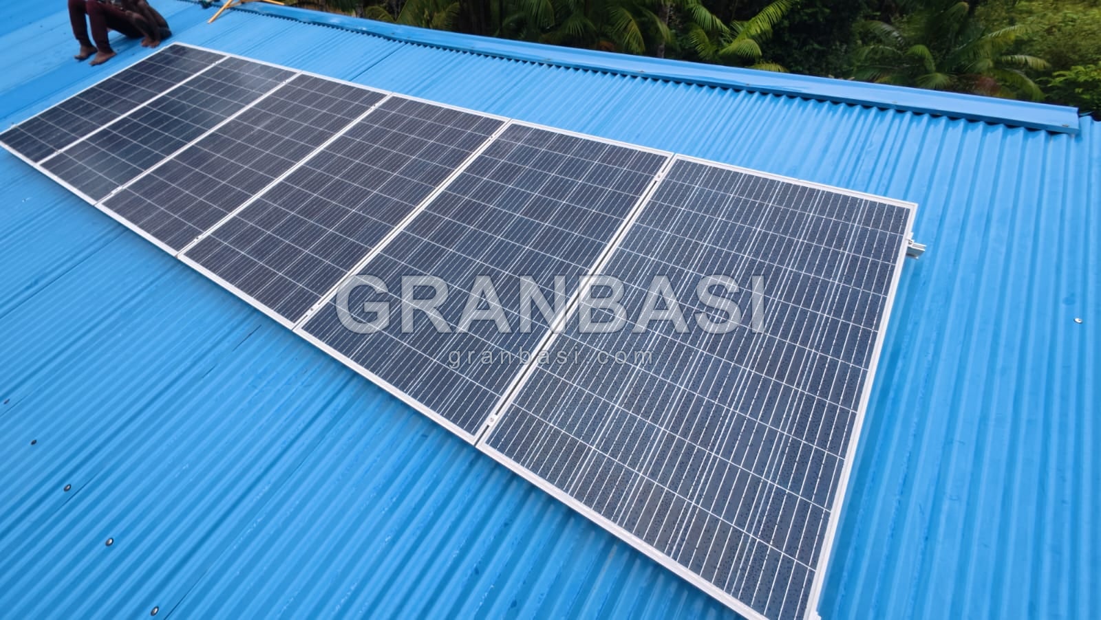 Row of panels on a blue roof